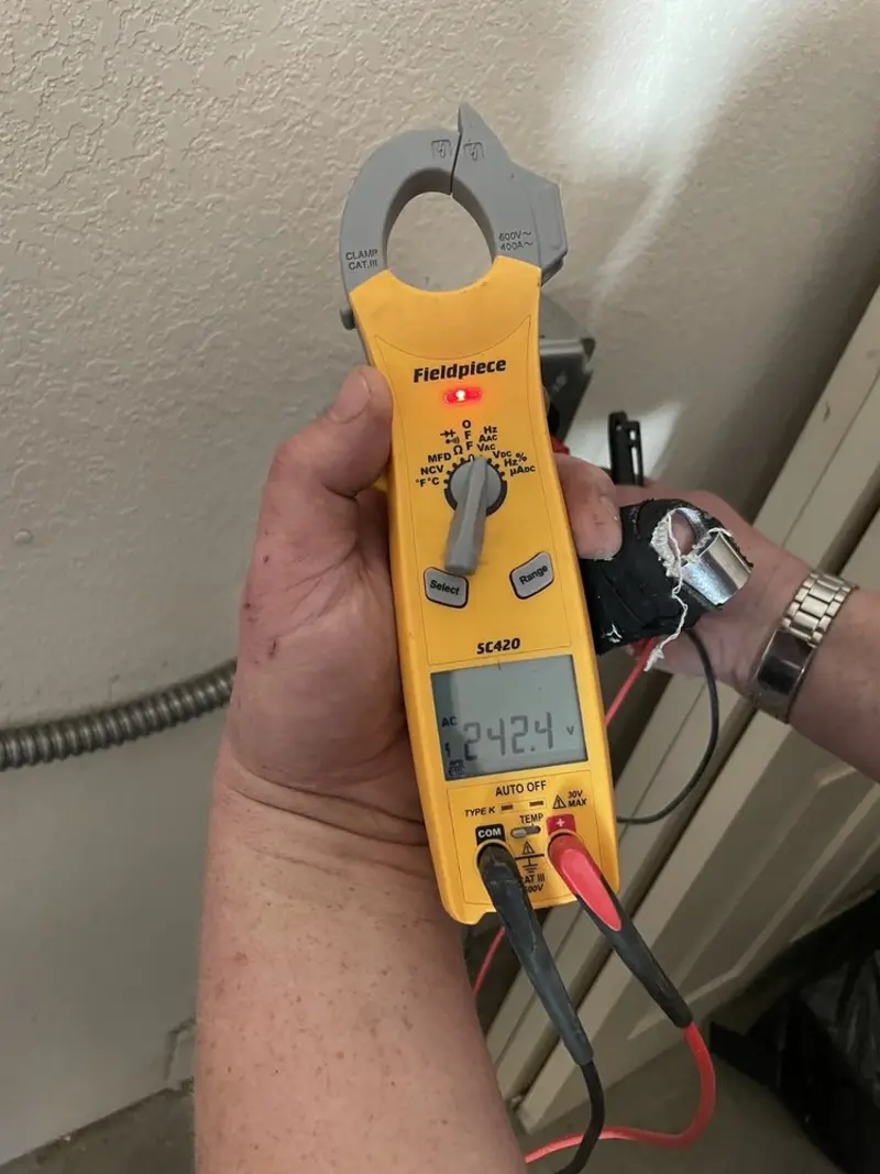 Voltage testing with clamp meter during Ceiling Fan Installation in Apple Valley
